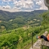 Woman sitting on a bench enjoying the views of Wachau valley
