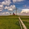 Cross and hikers on the summit of Reisalpe