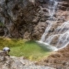 Ötschergräben Grand Canyon of Austria hiker takes a break at the Mirafall waterfall