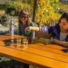 Two girls taking a break and trying some Grüner Veltliner wine on the Wachau World Heritage Trail